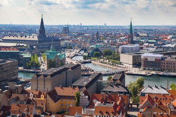 Fototapeta na wymiar Aerial view of Copenhagen red roofs and canal. Churches and palaces of Danish capital.
