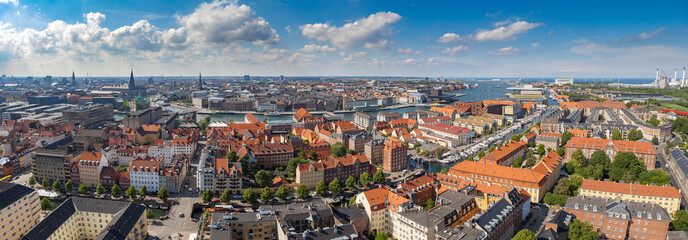 Naklejka na ściany i meble Wide panoramic aerial view of Copenhagen red roofs and canal.
