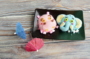 The hippopotamus, elephant are made of ice cream . A creative dessert for children and good mood.