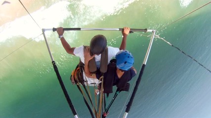 Flying over beautiful views. Hang gliding perspective over coastal sea. Flight sport
