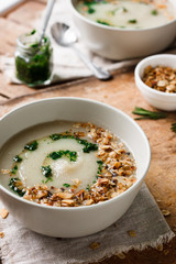 Celery cream soup with green oil and granola