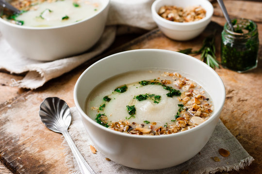 Celery cream soup with green oil and granola