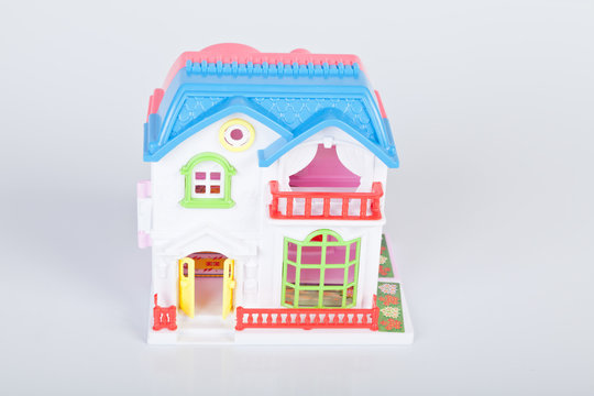 Plastic toy house on white background