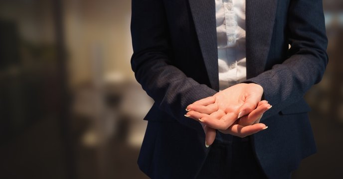 Business Woman Mid Section Holding Out Hands In Blurry Room