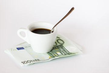 Coffee cup on money