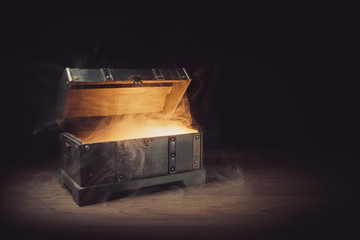open pandoras box with smoke on a wooden background