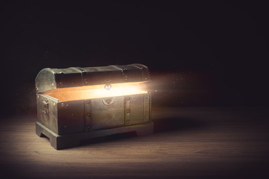 open pandora's box with smoke on a wooden background
