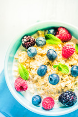 Tasty and light diet cereal breakfast with sumer fruits, wellbeing concept.