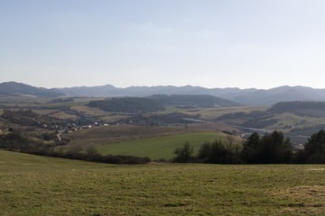 Fototapeta na wymiar Meadow with trees and views to mountains. Slovakia