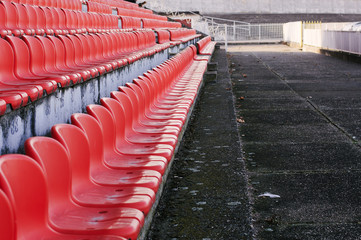 Empty stadium with red chairs
