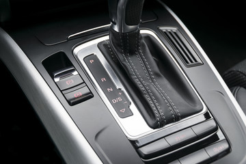 Obraz na płótnie Canvas automatic gear stick of a modern car, car interior details