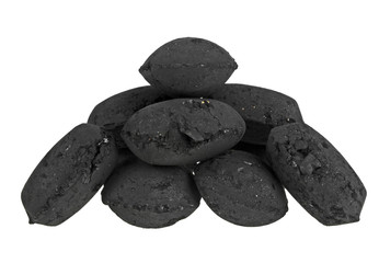 Small charcoal briquets used for barbecue isolated on white background