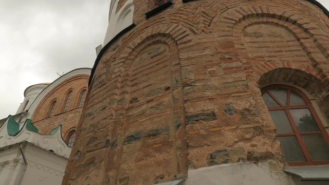 Panorama of Brown Brick Wall of Cathedral Architectural Heritage of Ukraine Orthodox Church Cloudy Springtime in Park Religious Building at the Nature