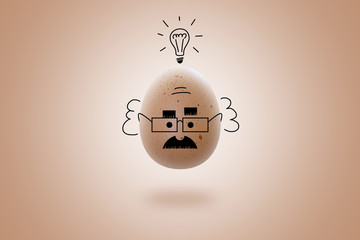 Funny Scientist Or Professor and lightbulb.
Hand drawn egg-head of a scientist on beige background. Isolated. Drawn on top of the photo