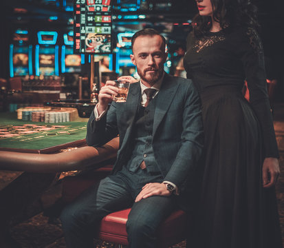 Upper Class Couple Gambling In A Casino