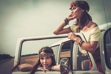 Hippie girls in a van on a road trip