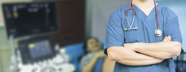  Medical ,Doctor surgeon posing with arms crossed in an operating theatre,surgical room,doctor with...