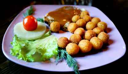 Photo dish of potatoes and chicken