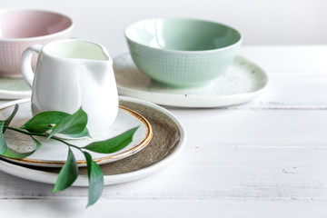 ceramic tableware with flowers on white background