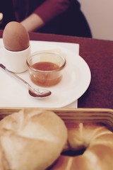 Austrian breakfast with boiled egg and fresh bread rolls
