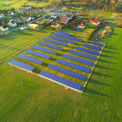 Aerial photo of solar power plant. Photovoltaic power station supplying electricity to small town...