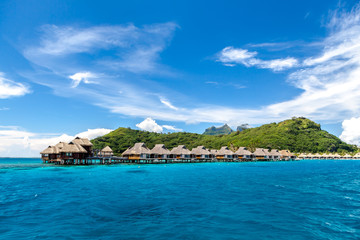 Over water bungalows on a tropical island Bora Bora, French Polynesia