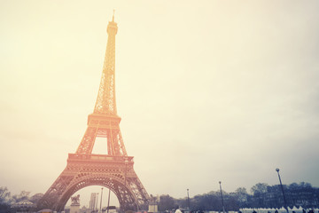 The Eiffel tower is one of the most recognizable landmarks in the world under sun light,selective focus,vintage color