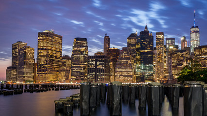 Night view at skyscrapers in Lower Manhattan taken from across the river, New York City, USA