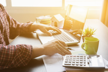 Website designer working digital tablet and computer laptop with digital tablet and digital design diagram wooden desk and compact server and graph financial with social network diagram,vintage color