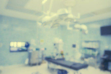 Blur of equipment and medical devices in modern operating room take with art lighting and blue filter,operating room with modern equipment.Operating room ready for operation