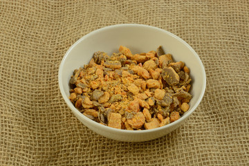 Bowl of crushed candy bar bits for cooking topping
