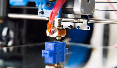 Electronic three dimensional plastic printer during work , 3D , printing.