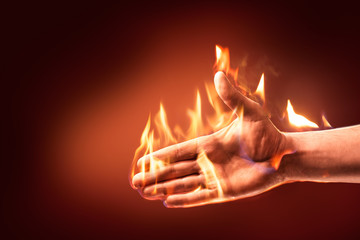 Hand on fire reaching out to shake