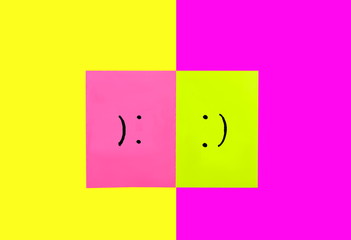 Happy and Sad face together isolated on colors background