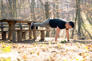 Man doing push-ups in the nature