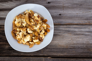 Poutine quebec meal with french fries, gravy and cheese curds