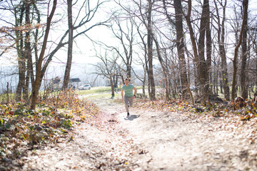 Young man running in nature
