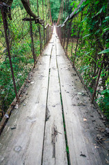 Obraz premium OId ruined rust cable bridge with