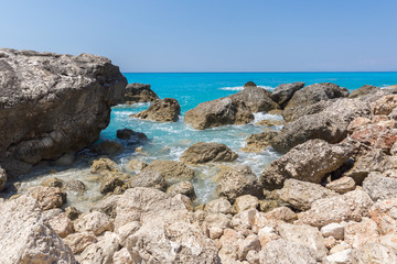 Fototapeta na wymiar Amazing landskape of blue waters of Megali Petra Beach, Lefkada, Ionian Islands, Greece
