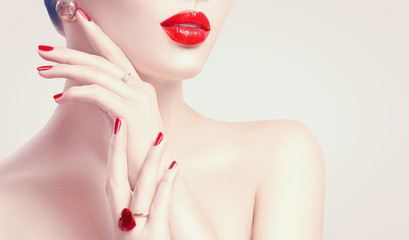 Sexy woman. Red lips and nails closeup. Manicure and makeup. Skincare concept