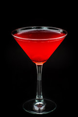 red cocktail on black background