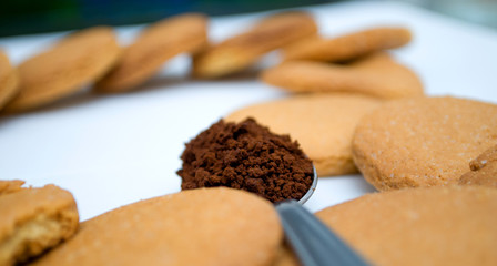 Heart shape made of gingerbread and teaspoon with black coffee