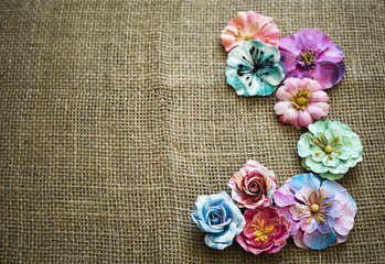 Fototapeta premium spring paper flowers on sack texture