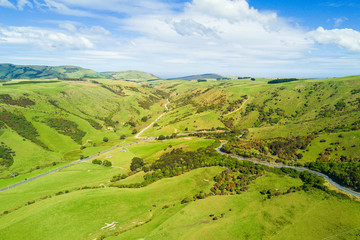 Fototapeta na wymiar 00:00 | 00:26 1×Aerial view of Green hills and valleys of the South Island, New Zealand