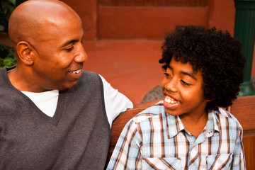 African American father and son spending time together.