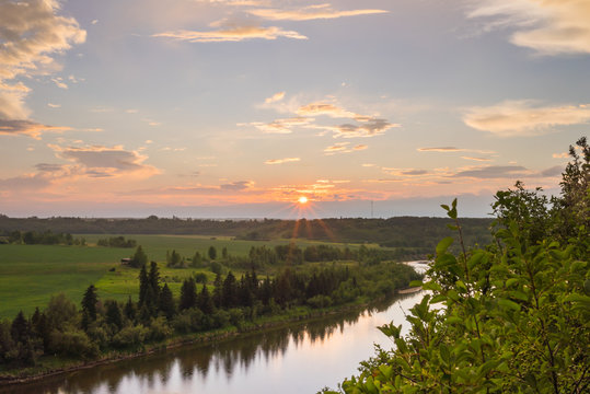 Sunburst Setting Above Red Deer River