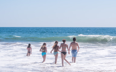 People are enjoying summer time on the beaches along Pacific ocean