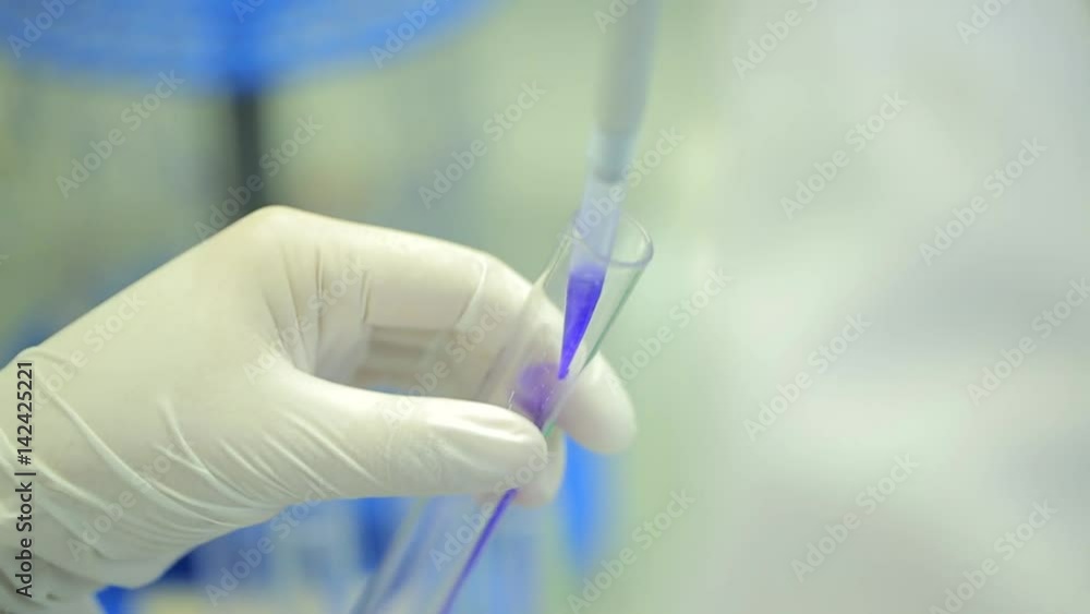 Poster test tubes closeup. medical equipment. close-up footage of a scientist using a micro pipette in a la