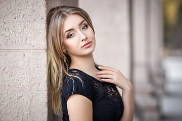 Beautiful girl portrait in a black dress
