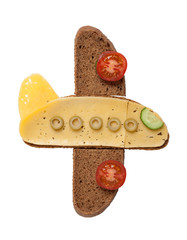 Plane created from bread and cheese on isolated background